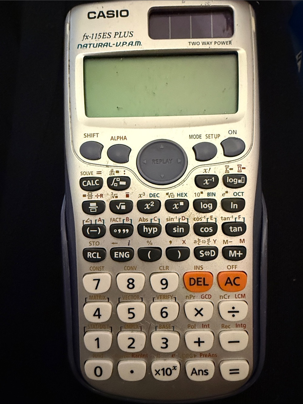 Casio fx-115ES PLUS scientific calculator in white, gray and orange